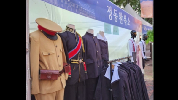 Trying to wear the clothes of a Japanese patrol officer and an emperor?